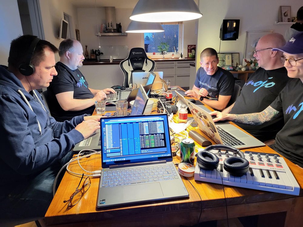 The coding session: laptops down both sides of the dining table